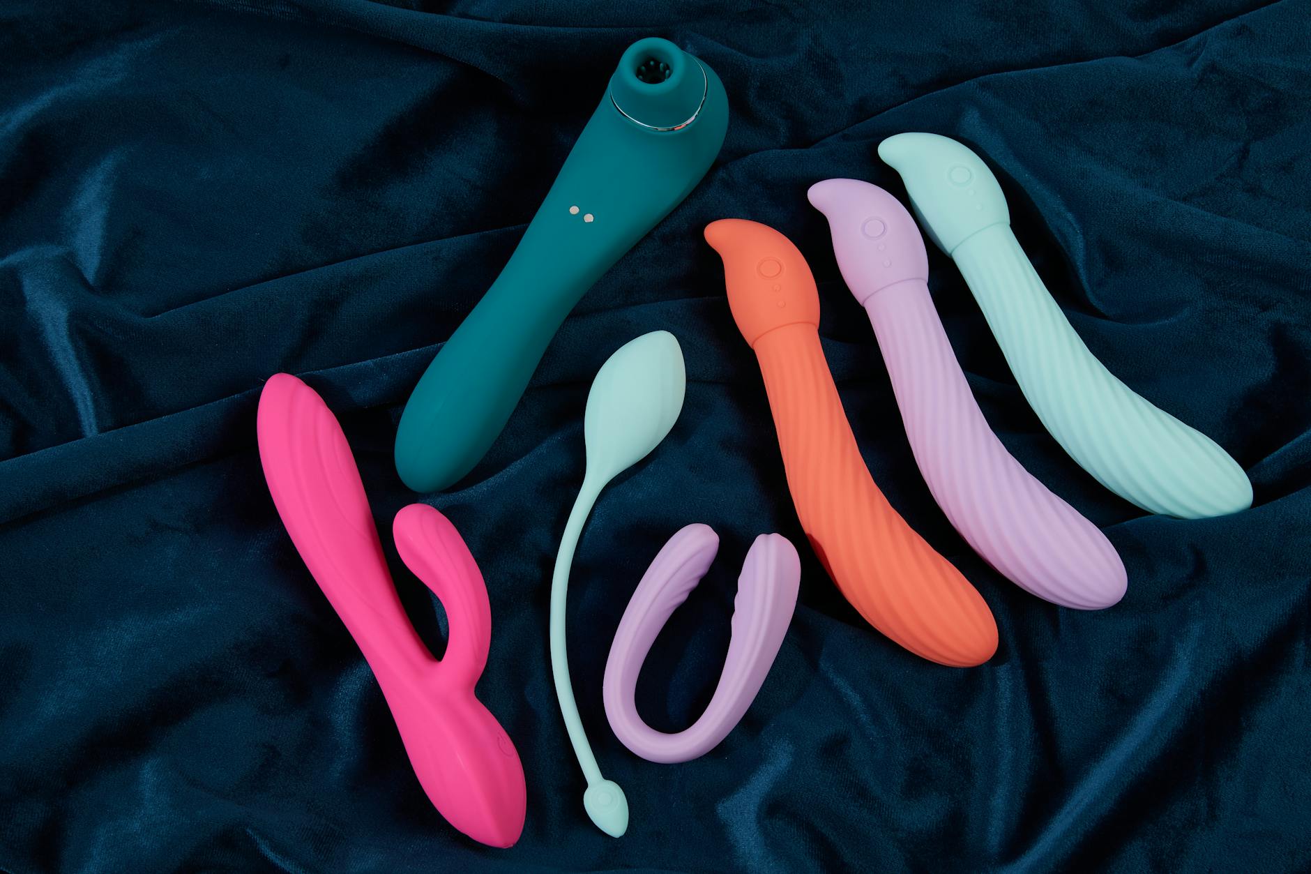 A couple holding a modern vibrator together, representing emotional reconnection and intimacy rebuilding